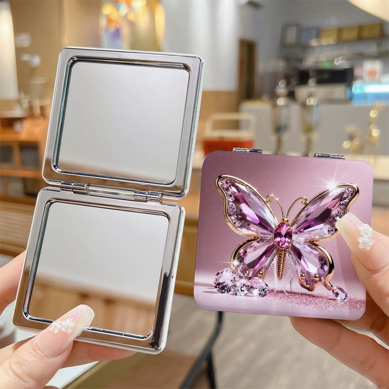 A Compact Square Mirror with a European And American Style, This Portable Mini Hand Mirror Is Perfect for Students. It Features a Cute Cartoon Design, Double-Sided Folding, And Magnification